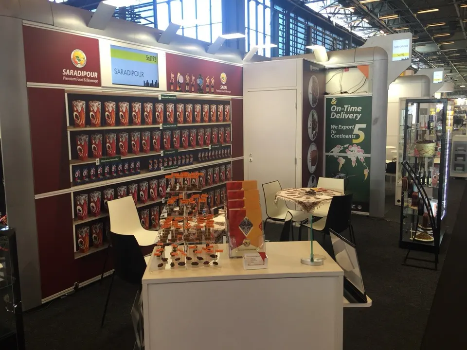 An exhibition stand with packaged date products and brochures